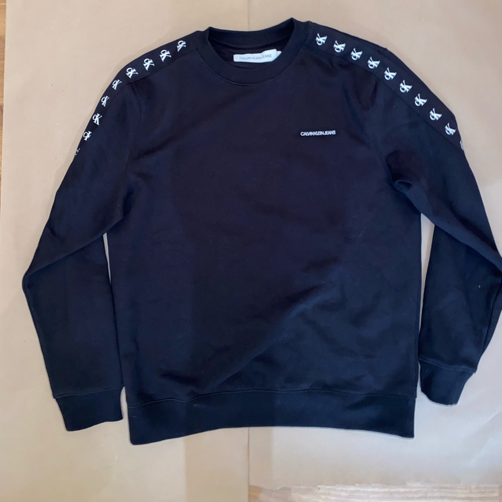 Black Calvin Klein sweater. New with tags.